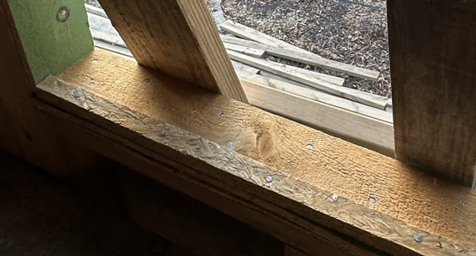 Adding a beveled siding sill to the window opening