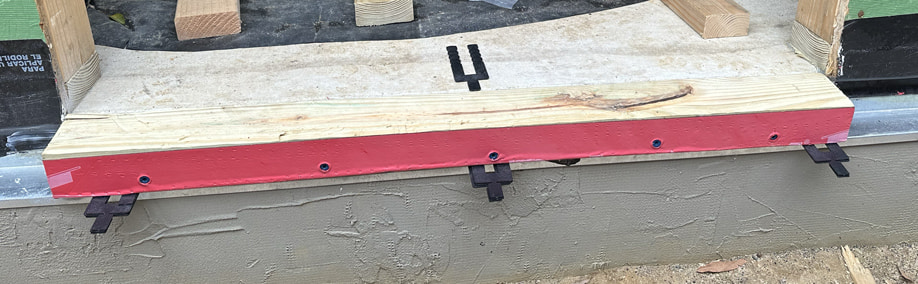 Making a door sill extension around the exterior insulation.