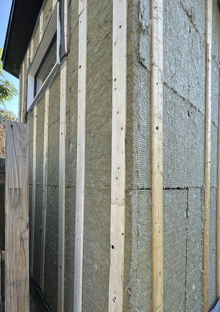 Pine Furring strips installed over continuous rockwool exterior insulation.