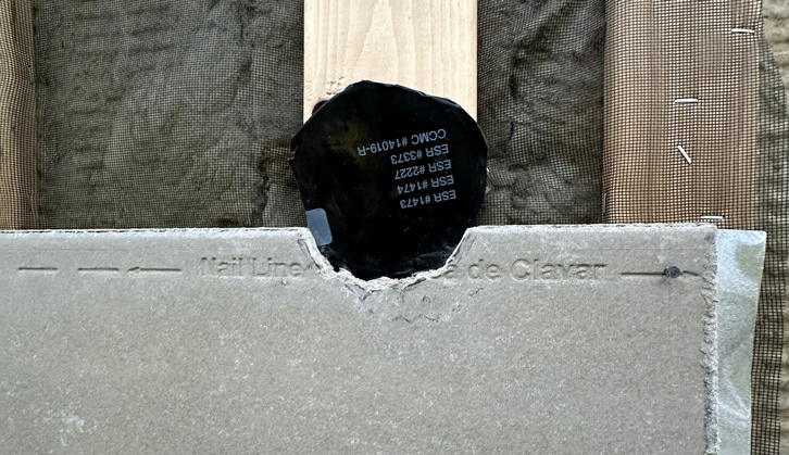 Minisplit penetration through siding and exterior insulation.