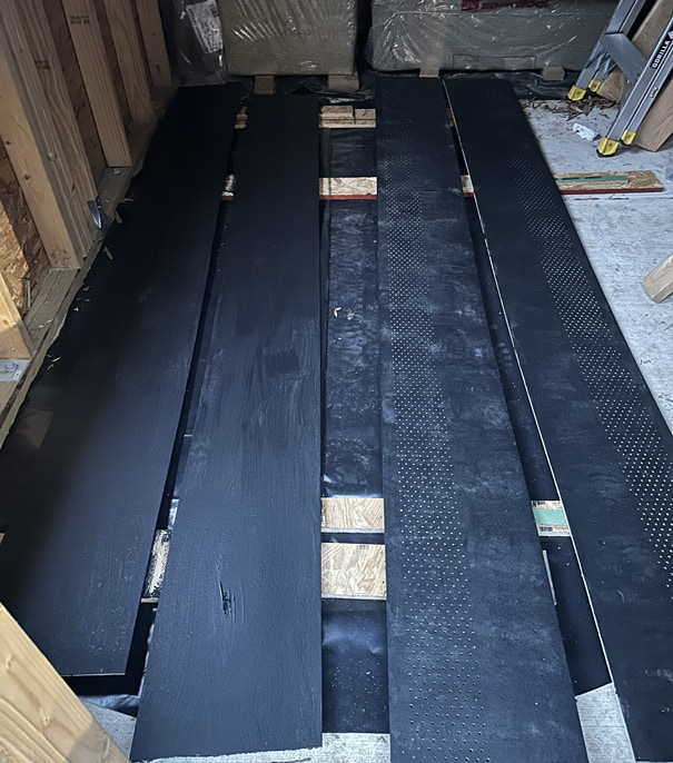 Hardie Soffit painted in Behr Carbon Black