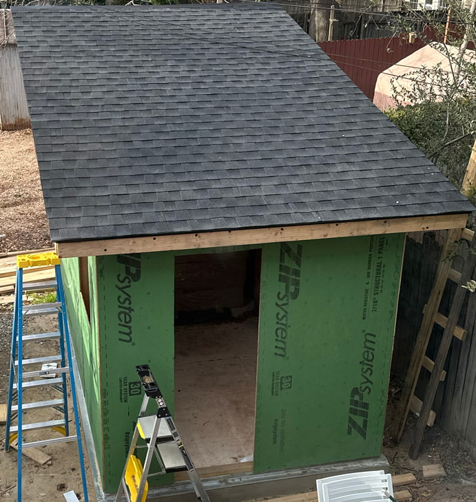 Roof with shingles on it.